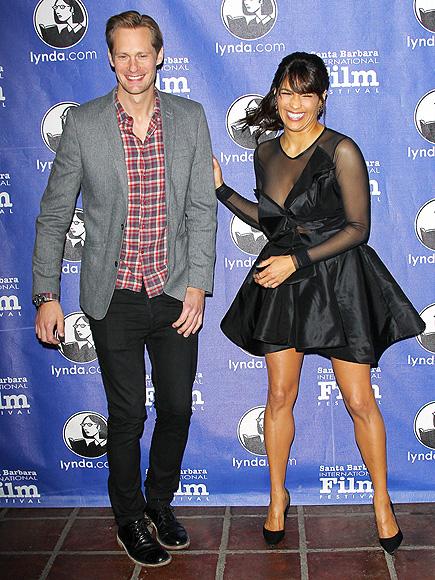 Paula Patton gets a laugh in while sporting a taffeta dress with sheer top 