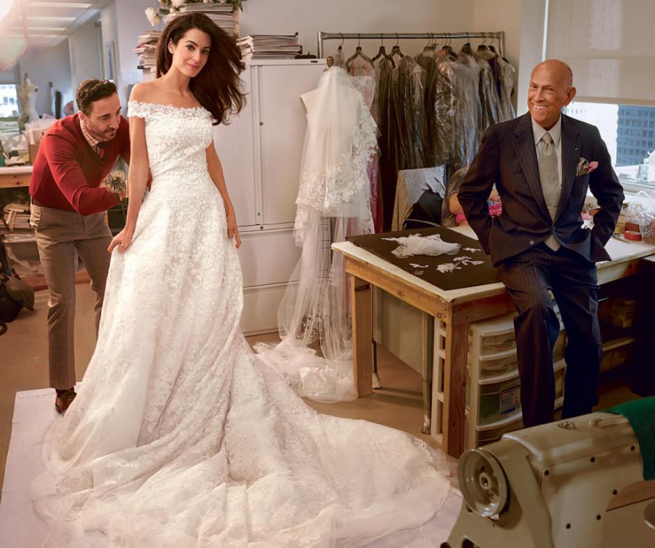 Last fitting: Amal Alamuddin in her custom Oscar de la Renta wedding dress. Image courtesy of Vogue.