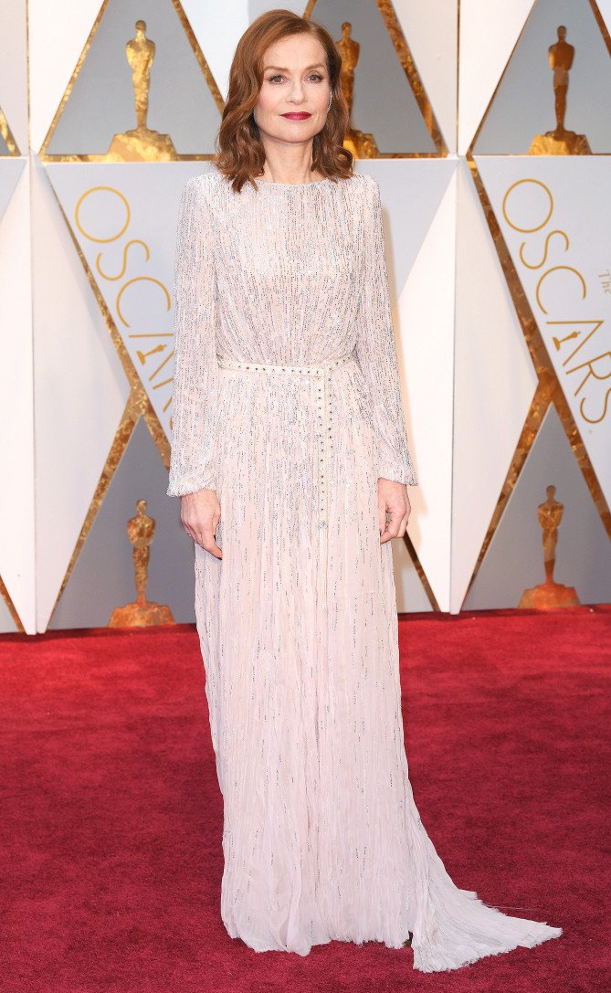 Best Actress Nominee, Isabelle Huppert attends the 2017 Oscars in a belted dress