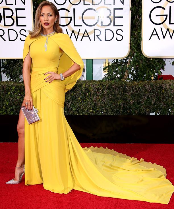 Jennifer Lopez came caped in a gorgeous marigold Giambattista Valli Haute Couture gown.